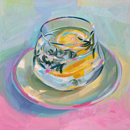 Original oil painting by Alai Ganuza titled "Lemon and Rosemary Tea". A clear glass cup containing a yellow lemon slice and green rosemary sprigs sitting on a saucer, painted on a pastel pink and blue background on a square wood panel.