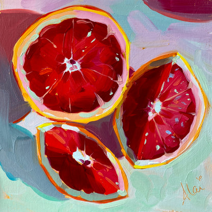 Original oil painting by Alai Ganuza titled "Grapefruit Slices". Three slices of ruby red grapefruit showing juicy segments, painted on a mint green background on a square wood panel.