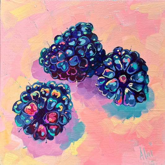 A square 15x15 cm original oil painting featuring three blackberries on a textured, soft pink background. Each berry is built with thick, raised ridges of dark blue and indigo paint, creating a sculptural 3D effect. Small, vibrant dots of neon pink, electric orange, and light teal serve as highlights on the individual drupelets. The berries cast soft, lavender, and teal-tinted shadows onto the pink surface, showing a distinct teal underpainting peeking through the layers of heavy impasto brushwork.