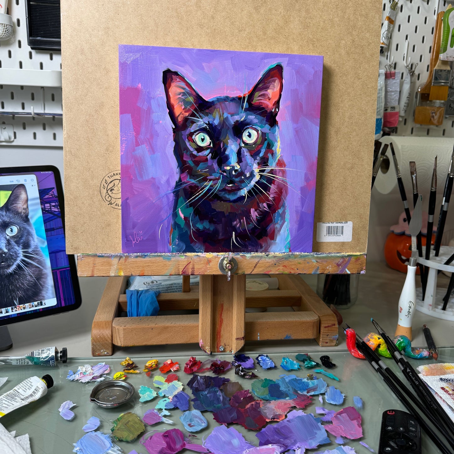A vibrant oil portrait of Boo, a black cat, using deep violets and spectral light to create form against a soft lavender-purple background.