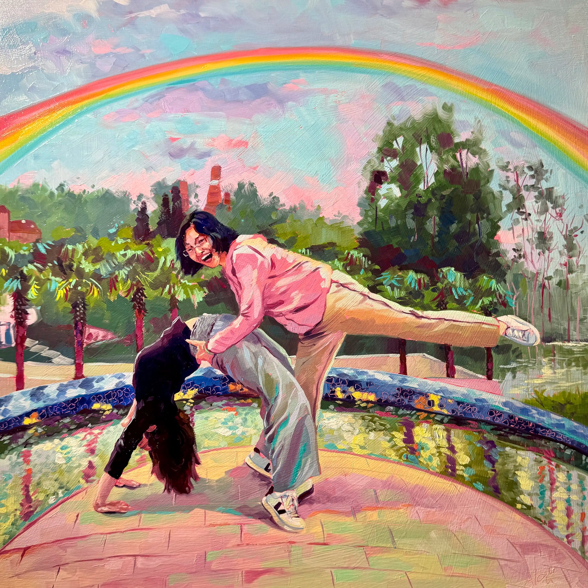 An original 40x40 cm oil painting of a mother and daughter playfully balancing together by a park pond. Set under a bold, vibrant summer rainbow and blue sky with thick impasto texture.