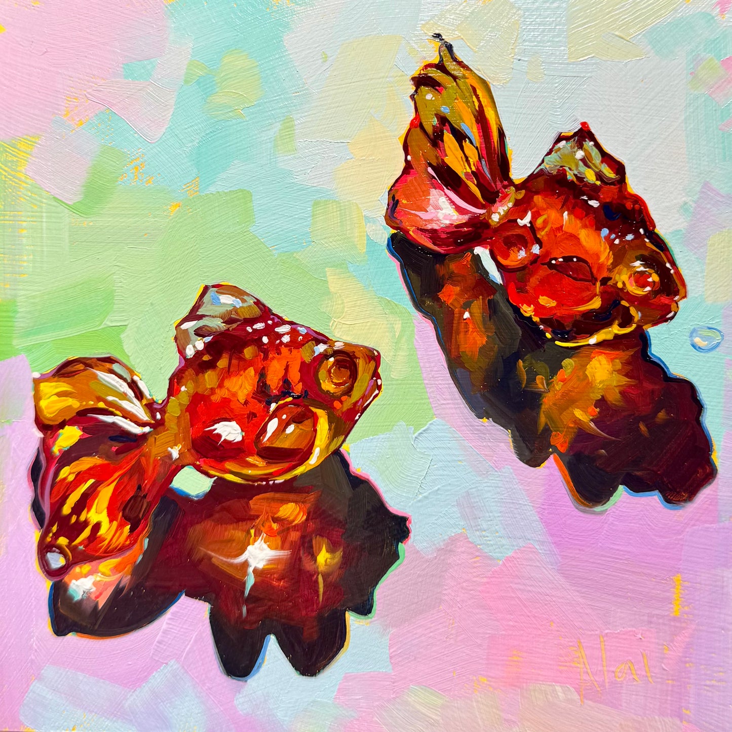 A 15x15 cm original oil painting by Alai Ganuza titled "Goldfish Gummies." Two orange gummy-style goldfish are rendered in dense, thick impasto with glowing neon highlights. The background is a soft mosaic of mint, lavender, and pink with deep, saturated shadows.