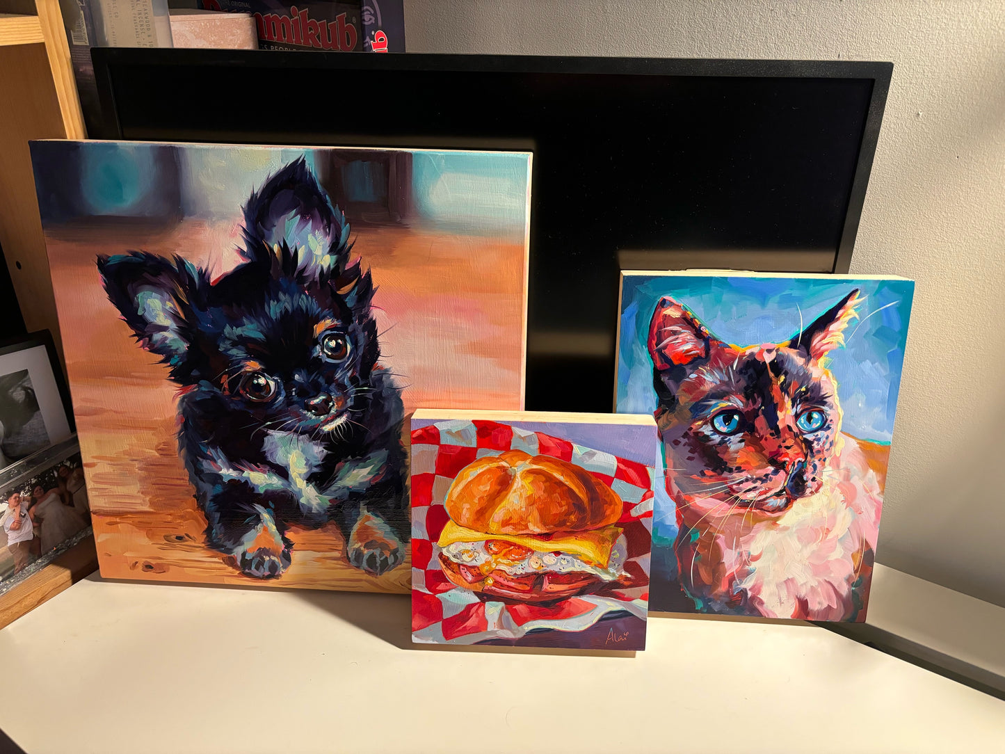 A high-contrast chromatic oil painting of Eliza the cat, featuring kaleidoscopic blue and violet fur highlights, thick impasto texture, and a soulful expression on a 12x12 wood panel.