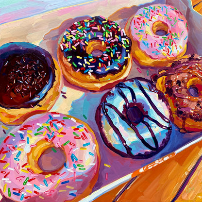 Original oil painting by Alai Ganuza titled "Six Pack". A high-angle view of a box containing six assorted donuts with chocolate, pink, and blue frosting and sprinkles, painted on a square wood panel.