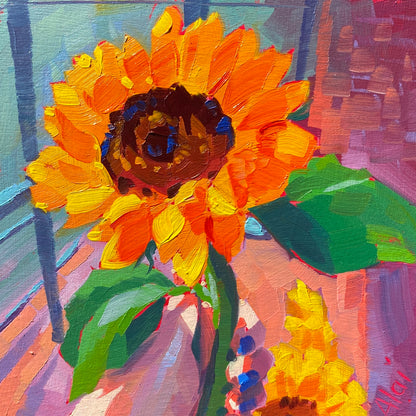 Original oil painting by Alai Ganuza titled "Sunflower Study". A bright orange and yellow sunflower with green leaves painted on a small square wood panel with a purple and pink background.