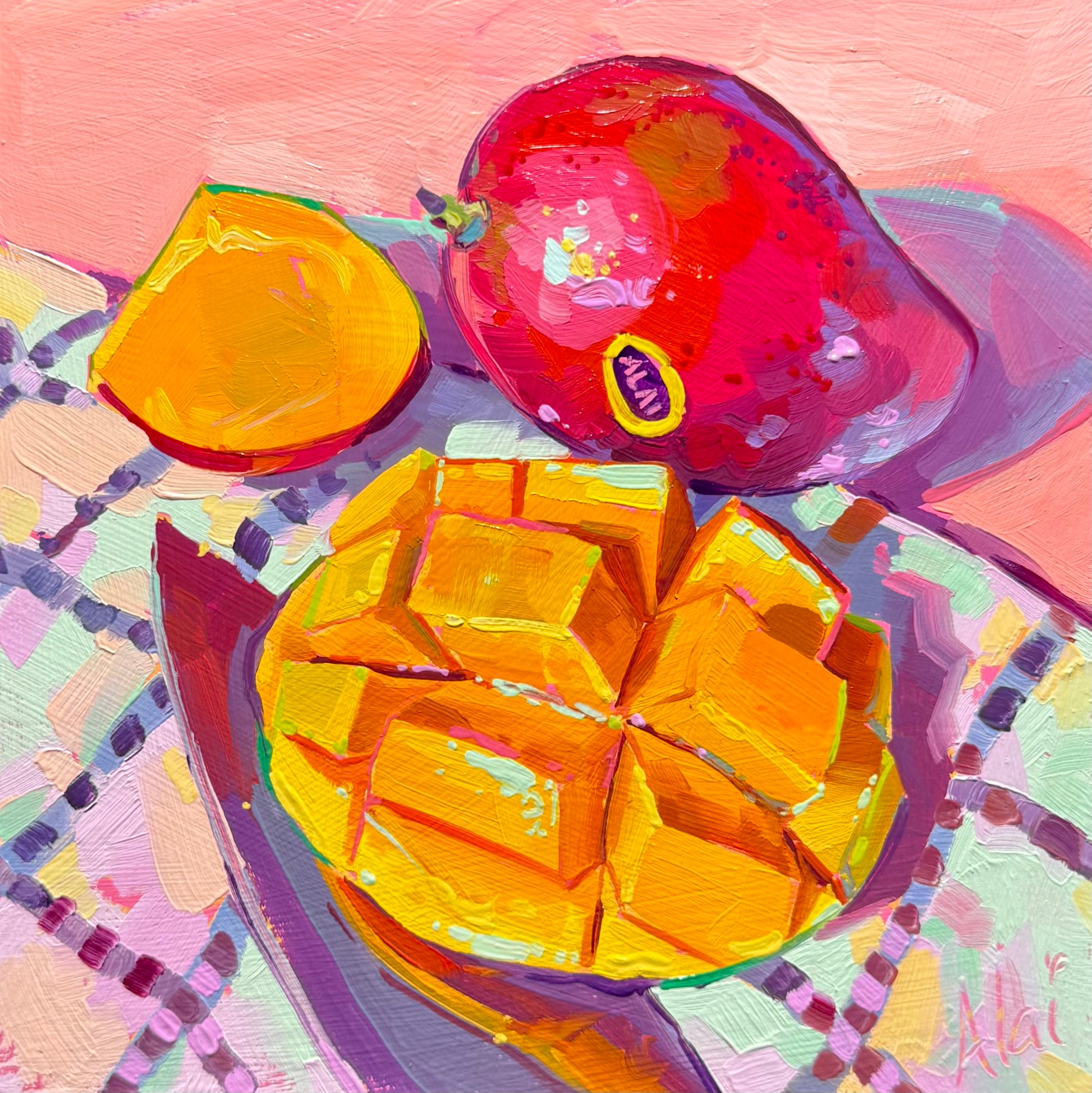 Original 15x15 cm oil painting by Alai Ganuza titled "Mango Cubes." It features a whole deep red mango and a sliced mango half cut into golden cubes on a checkered pink and mint tablecloth. Heavy impasto brushwork with vibrant orange, pink, and teal highlights against a soft pink background.