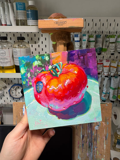 Alai holding her pomodoro painting, high contrast still life