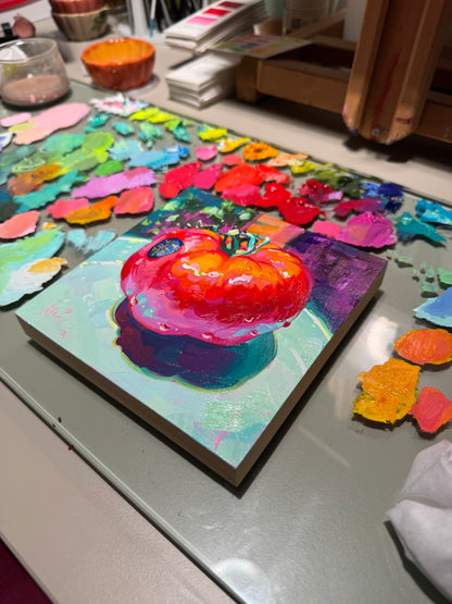 another angle of Pomodoro, it depicts a vibrant still life study of a single, large red heirloom tomato resting on a pale mint-green plate. The artwork features thick, blocky impasto oil brushstrokes on a square wooden canvas, highlighting rich scarlet and hot pink tones on the glossy skin, a green vine stem, an oval blue sticker, and a dramatic deep purple shadow cast beneath it against a magenta background.