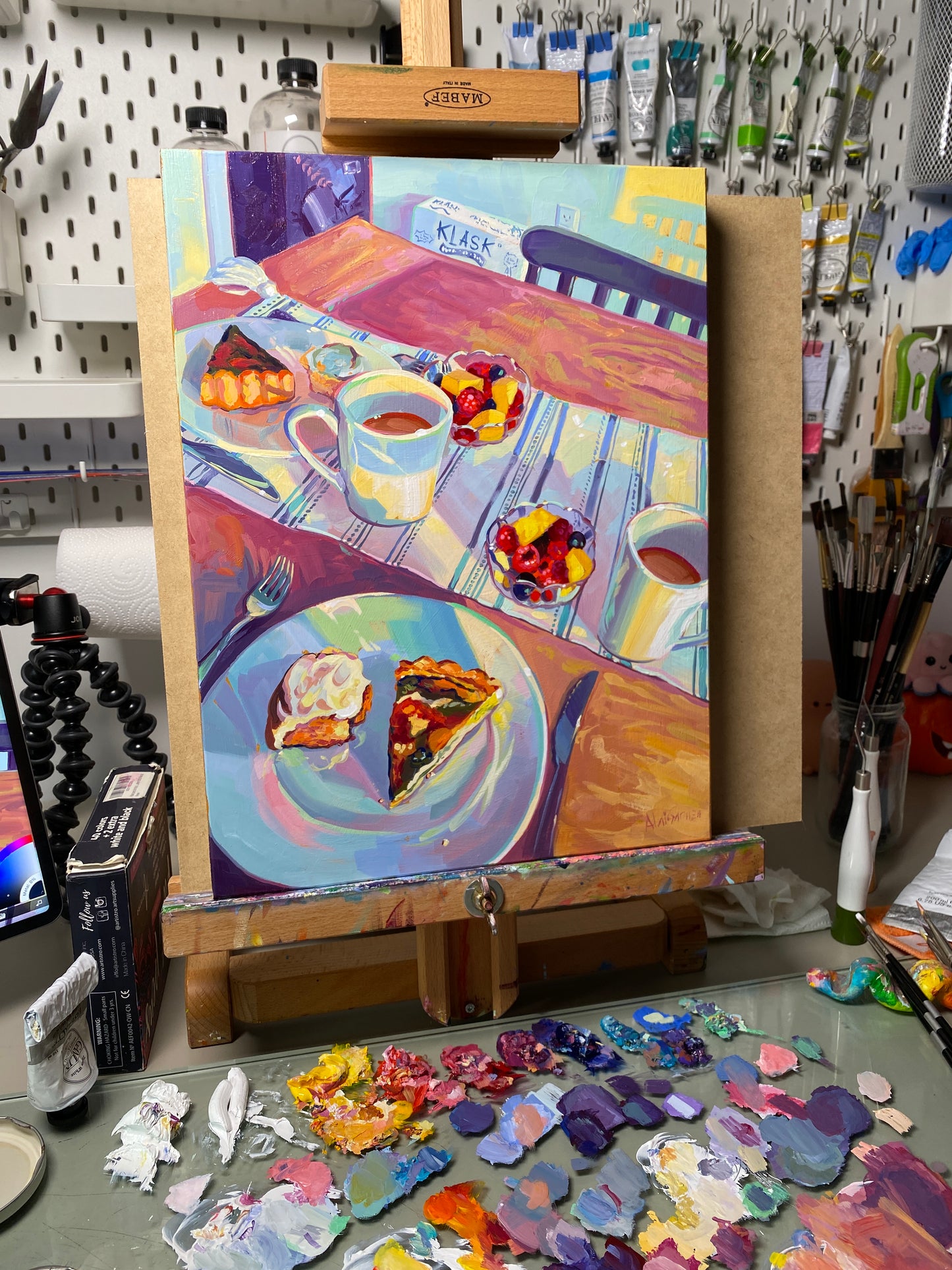 A high-contrast prismatic oil painting titled 'Sunny Breakfast' by Alai Ganuza, featuring a kitchen scene with vibrant yellows, electric blues, and thick impasto texture on a wood panel.
