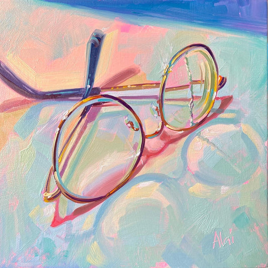 Original oil painting by Alai Ganuza titled "Broken glasses". A delicate pair of round, wire-rimmed eyeglasses with a broken arm resting on a pastel surface, casting vibrant pink shadows.