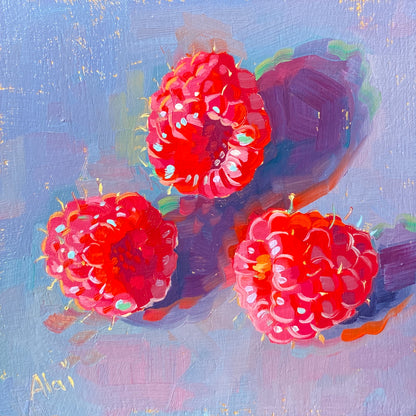 Original oil painting by Alai Ganuza titled "Three raspberries in gold". Three bright pinkish-red raspberries casting deep purple shadows on a textured lavender-blue background, with subtle flecks of a golden underpainting shining through.