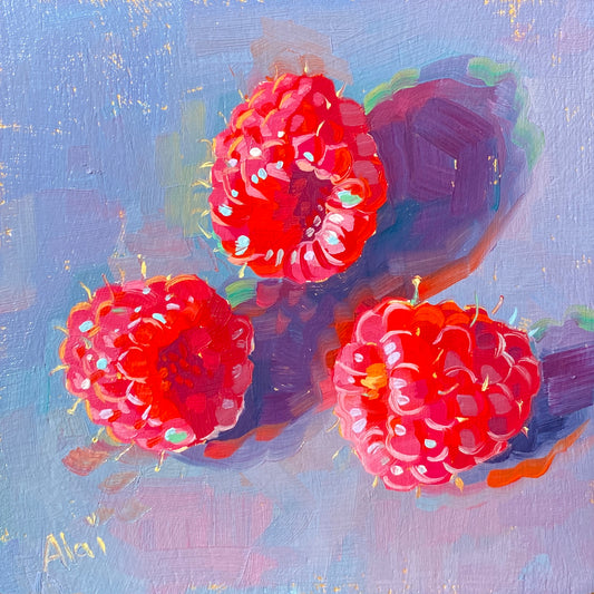 Original oil painting by Alai Ganuza titled "Three raspberries in gold". Three bright pinkish-red raspberries casting deep purple shadows on a textured lavender-blue background, with subtle flecks of a golden underpainting shining through.