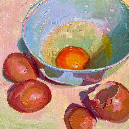 Original oil painting by Alai Ganuza titled "Raw egg in bowl". A single vibrant orange egg yolk inside a light blue bowl, surrounded by several brown eggshells on a pink surface, rendered in thick impasto with prismatic highlights.
