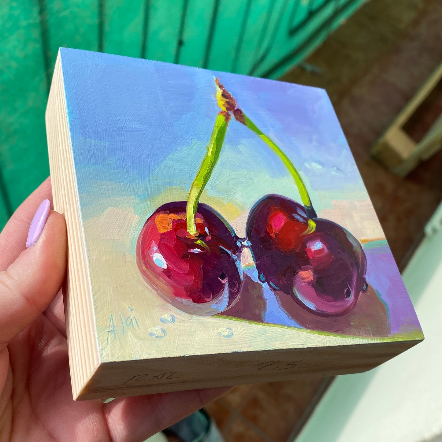Pintura al óleo de cerezas besándose