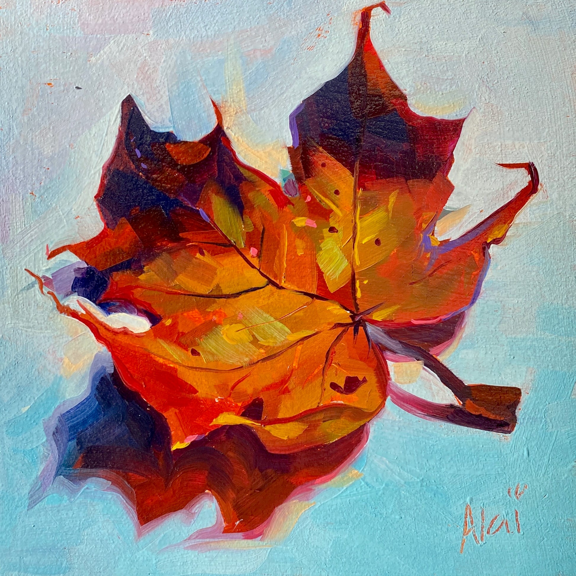 Original oil painting by Alai Ganuza titled "Leaf". A single dry autumn maple leaf painted in vibrant orange, red, and brown tones, casting a purple shadow on a light blue background.