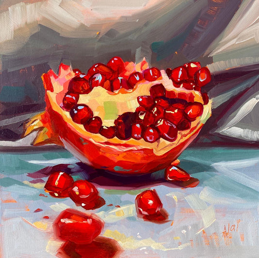 Original oil painting by Alai Ganuza titled "Pomegranate". A horizontal half of a pomegranate revealing glistening red seeds inside, with a few loose seeds scattered in front, rendered in thick impasto on a muted grey background.