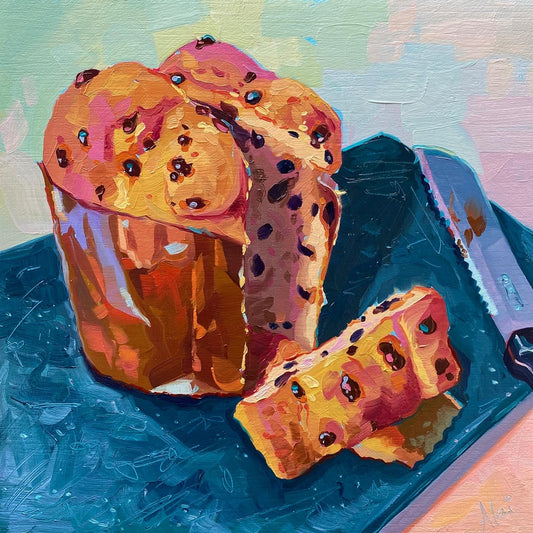 Original oil painting by Alai Ganuza titled "Panettone". A golden panettone loaf with dark chocolate bits and a slice cut out, rendered in thick impasto on a dark teal surface against a pale background.