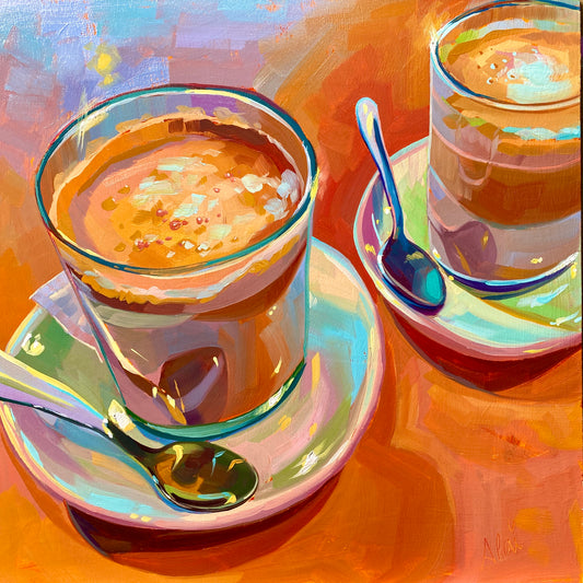 Original oil painting by Alai Ganuza titled "Coffee for two". Two glasses of coffee with spoons on saucers, rendered in thick impasto with vibrant orange, yellow, and teal tones against a warm, sun-drenched background.