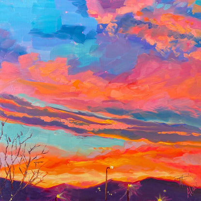 Original oil painting by Alai Ganuza titled "Fiery sky". A dramatic sunset with vibrant pink, orange, and blue clouds above a dark mountain silhouette with distant streetlights, rendered in thick impasto brushwork.