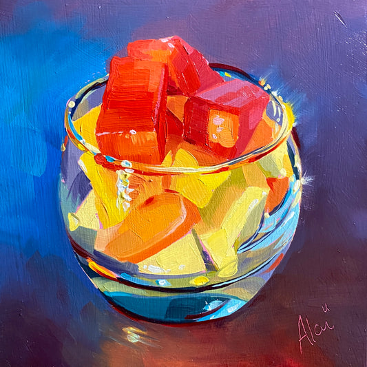 Original oil painting by Alai Ganuza titled "Fruit macedonia". A glass cup filled with vibrant red, orange, and yellow fruit chunks, featuring thick impasto brushwork and a pink underpainting visible against a dark purple and blue background.
