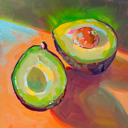 Original oil painting by Alai Ganuza titled "Glowing Avocados". Two halved avocados, one with a pit, featuring radiant green flesh and purple shadows on a warm orange background.
