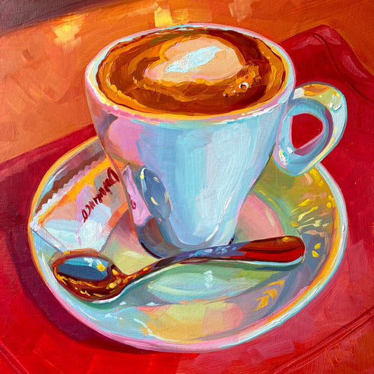 Original oil painting by Alai Ganuza titled "Coffee at El Dinamico". A light blue coffee cup with heart-shaped latte art on a saucer with a red-handled spoon and sugar packet, set against a vibrant red and orange background.