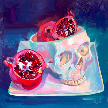 Original oil painting by Alai Ganuza titled "Brains!". Halved red pomegranates overflowing from a white ceramic skull bowl, resting on a square plate against a deep blue background.