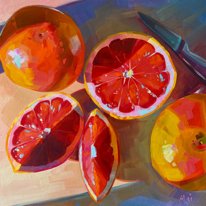 Original oil painting by Alai Ganuza titled "Grapefruits in the Evening". Several sliced ruby red grapefruits and a knife resting on a surface, illuminated by warm, directional evening light casting deep purple shadows.