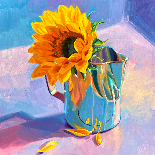 Original oil painting by Alai Ganuza titled "Sunflower in jar". A large, vibrant yellow sunflower in a light blue reflective glass jar with fallen petals on a lavender and pink surface, featuring thick impasto and colorful shadows.