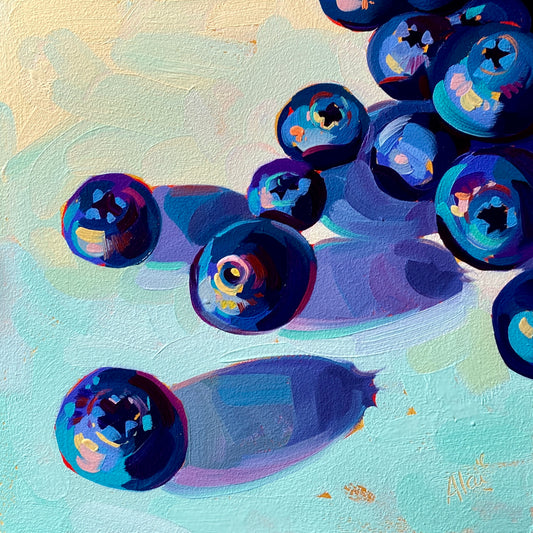 Original oil painting by Alai Ganuza titled "Golden Blueberries". A scattered arrangement of plump blue blueberries with purple shadows, painted against a textured background of pale gold and soft teal on a square aluminum panel.